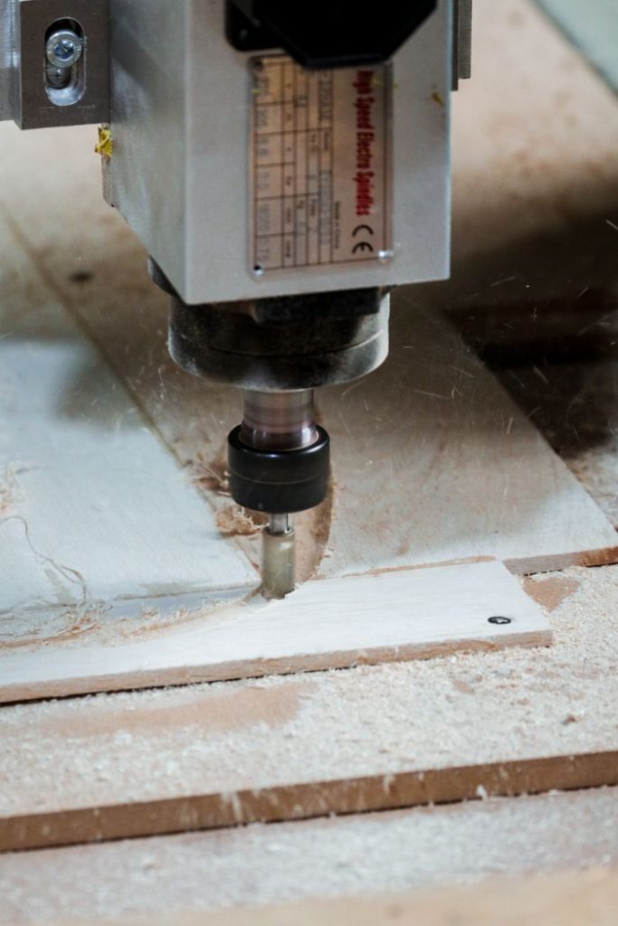 Crafting Captivating Headlines: Your awesome post title goes here Close-up of a milling machine cutting wood in a workshop setting.